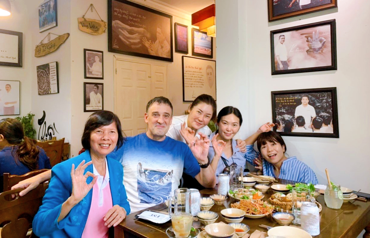 International guests reacting with delight after trying Vietnamese vegan specialties
