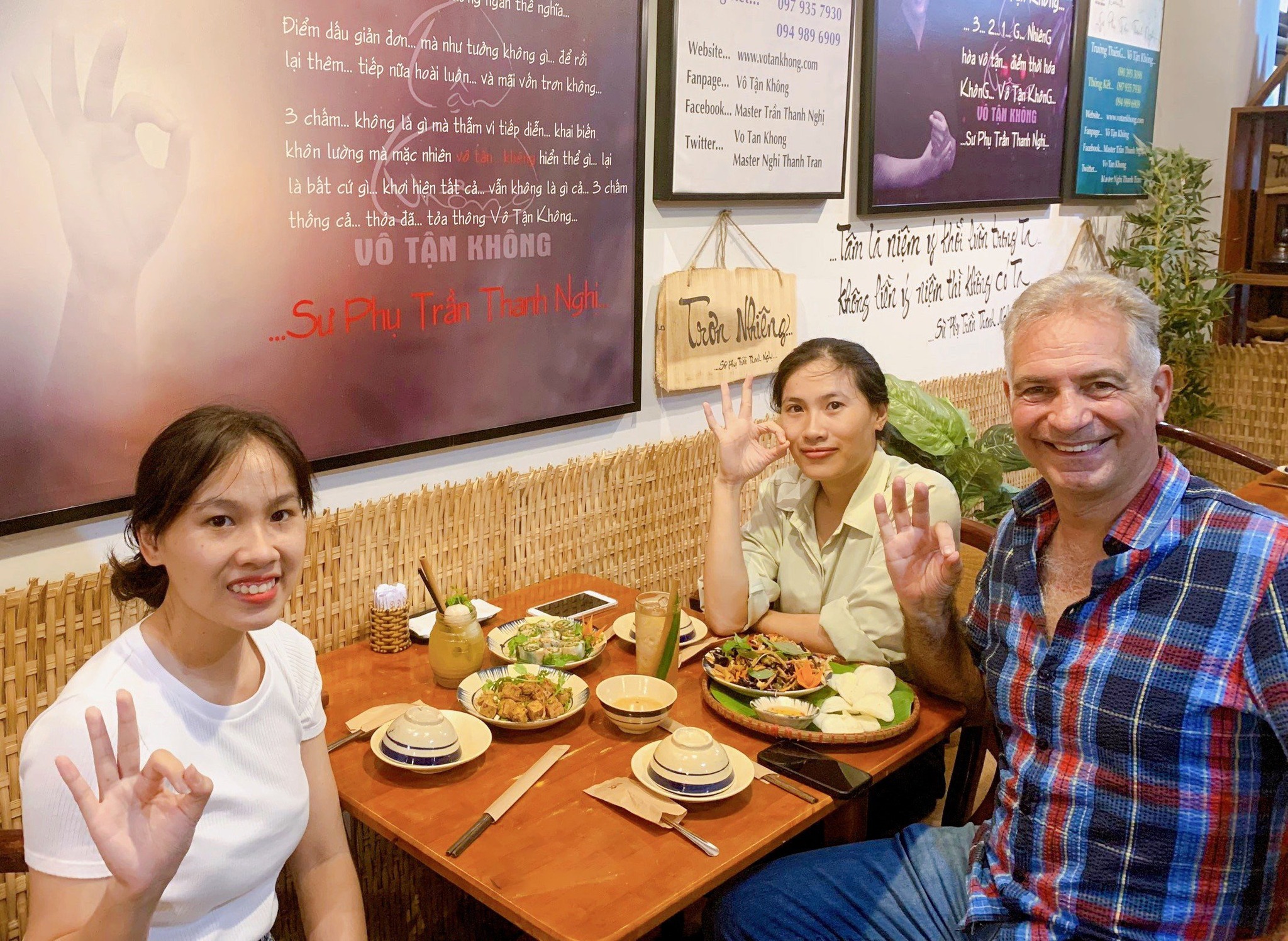 Foreign visitors sharing a joyful vegetarian dining moment in Ho Chi Minh City