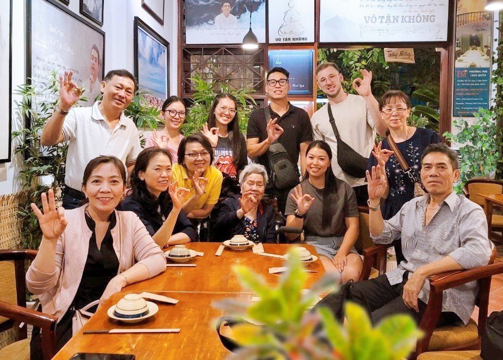 International visitors reacting positively after tasting Vietnamese plant-based specialties