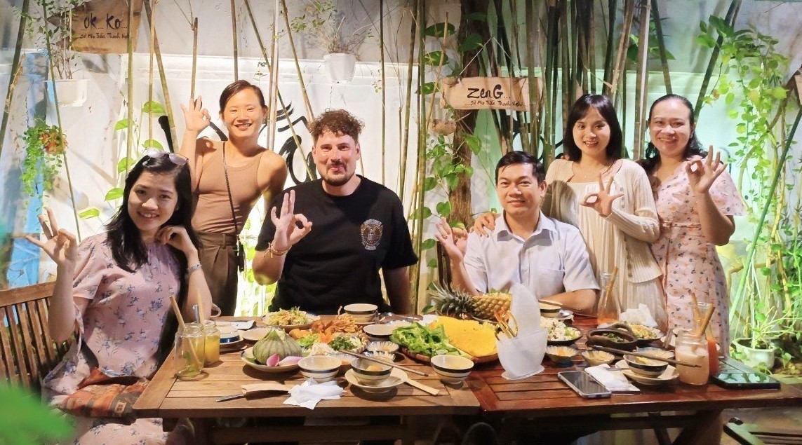 International Guests Dining in a Peaceful Vegan Restaurant in Saigon v