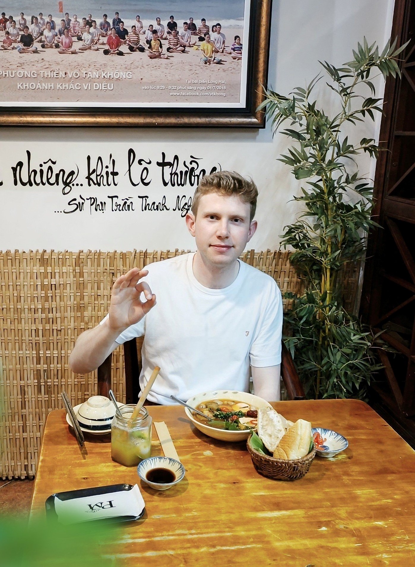 Smiling Foreign Guests at Nhà hàng chay Phương Mai Restaurant International guests smiling while tasting Vietnamese vegan specialties at Nhà hàng chay Phương Mai