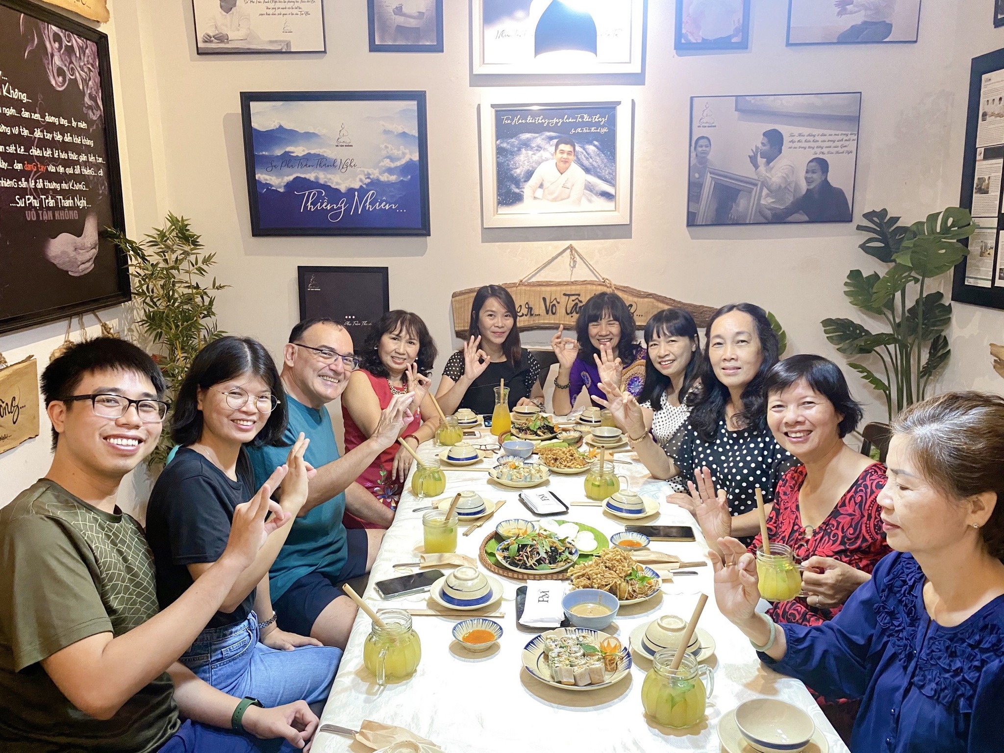 International guests enjoying authentic vegan food at a hidden alley restaurant in Saigon
