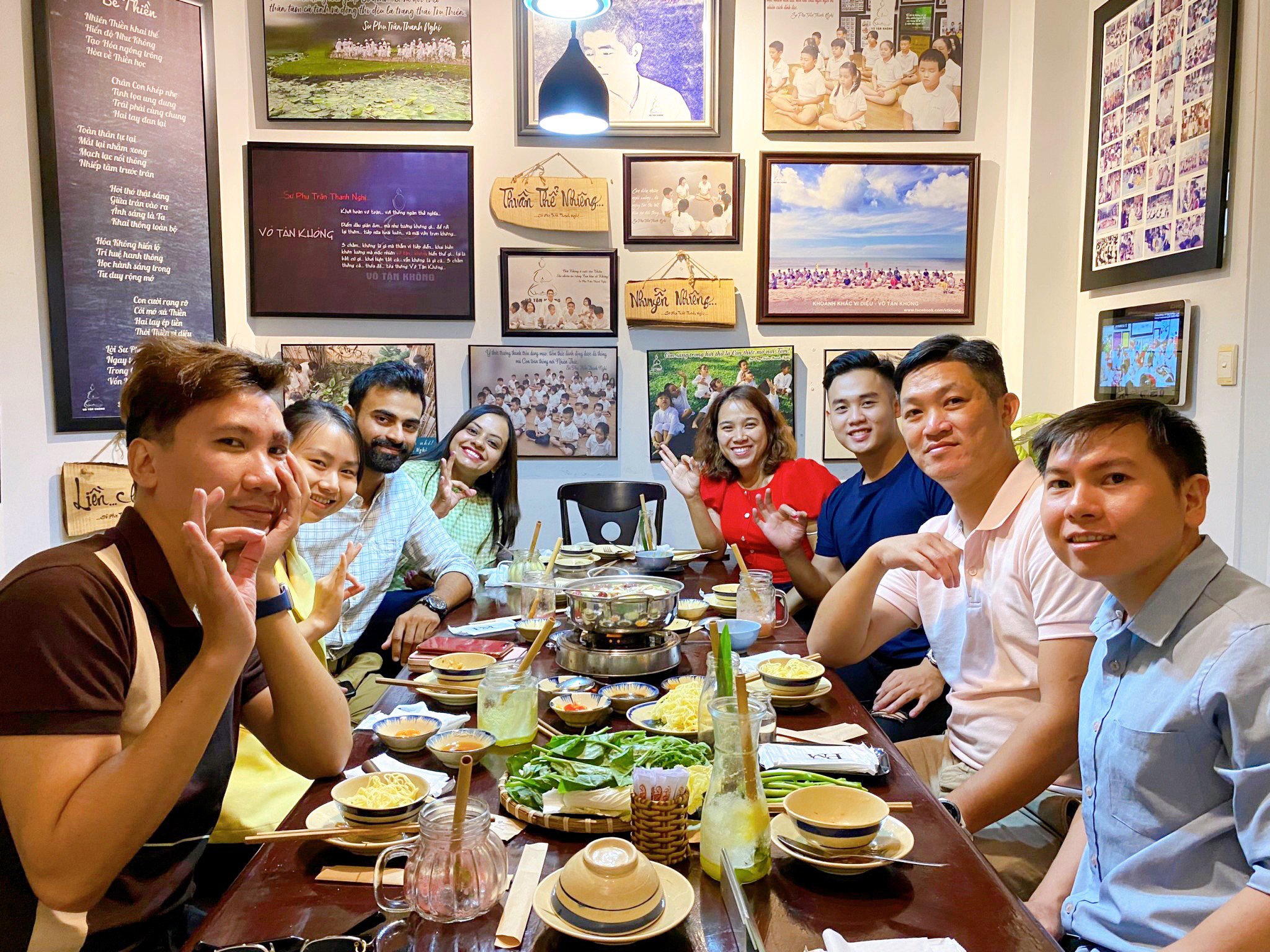 Happy visitors enjoying traditional Vietnamese vegetarian cuisine in District 1 Saigon