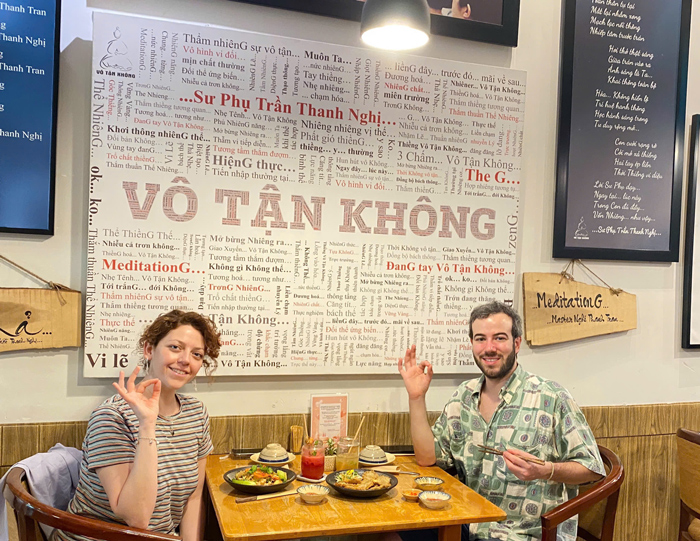 Foreign visitors enjoying lunch at popular vegan restaurant Saigon
