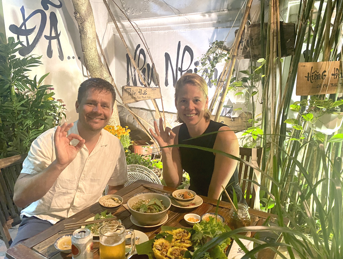 International diners experiencing vegetarian restaurant District 1