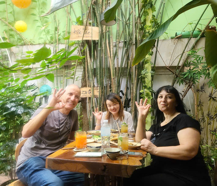 Tourists enjoying plant-based food at a vegetarian restaurant in Ho Chi Minh City.