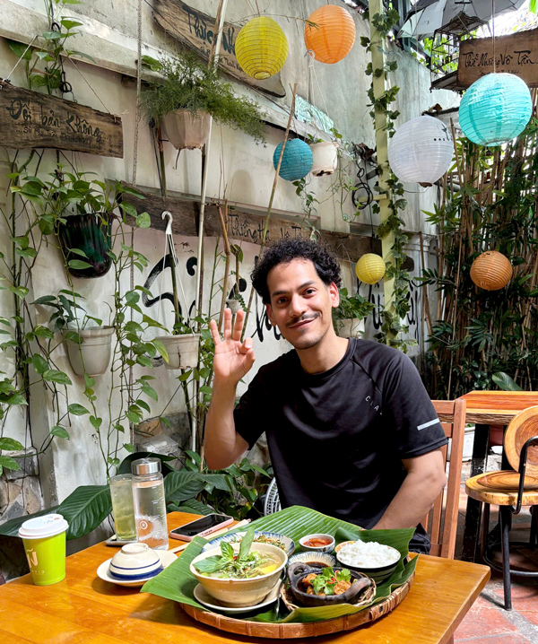 Tourists enjoying vegan restaurant atmosphere in Vietnam