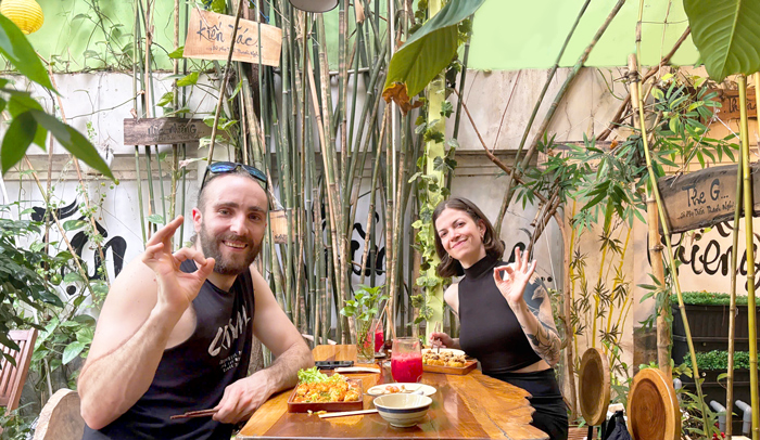 International visitors enjoying healthy vegan lunch Saigon District 1