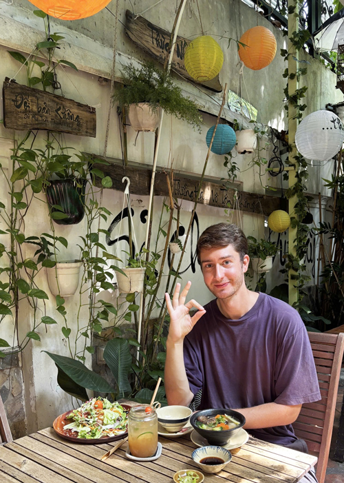 Foreign diners enjoying healthy vegetarian dishes in District 1.