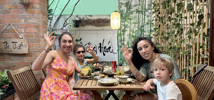 Tourists enjoying a relaxed vegan dinner at Phuong Mai