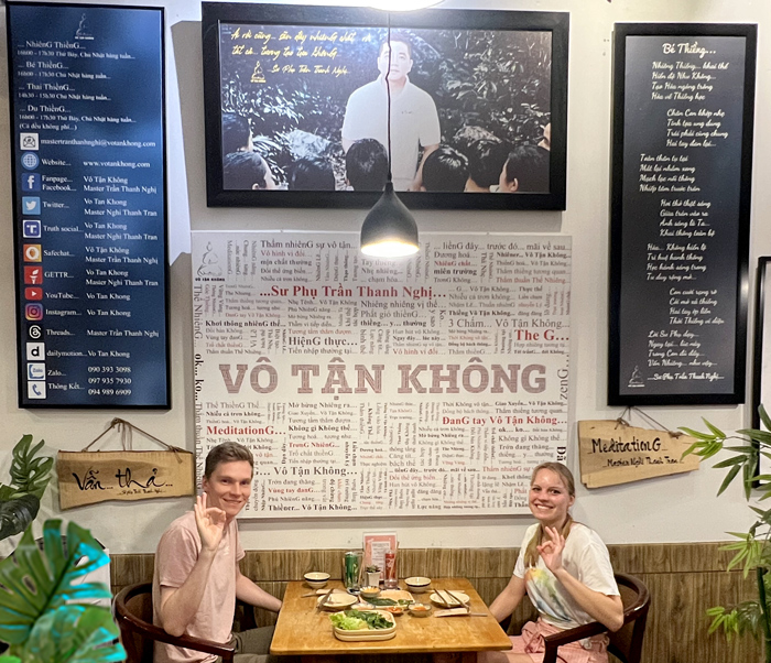 Backpackers dining at affordable vegan restaurant District 1