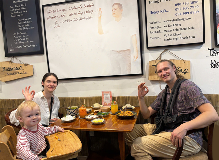 Foreign travelers enjoying vegetarian dining in District 1, Ho Chi Minh City.