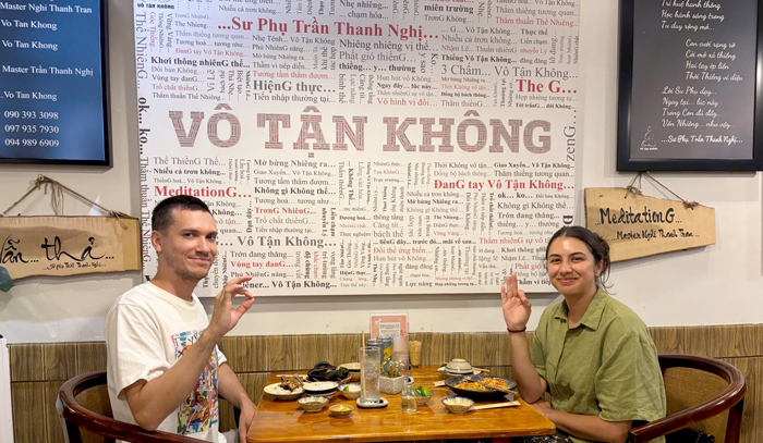 Foreign tourists exploring vegetarian food at Phuong Mai.