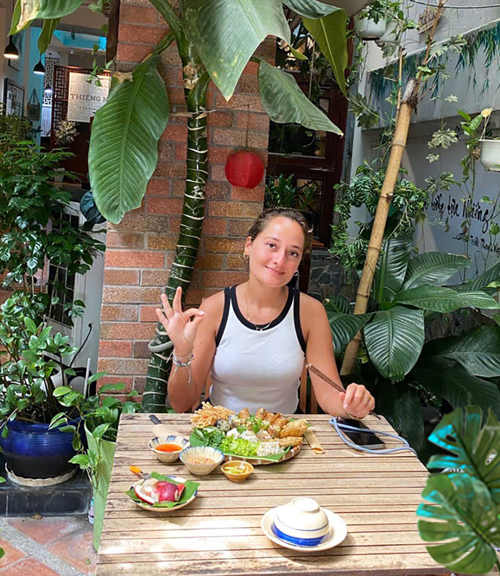 Tourists enjoying a vegetarian meal while traveling in Saigon.
