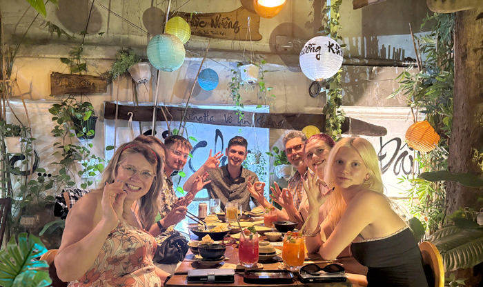 International guests enjoying vegan cuisine at Phuong Mai