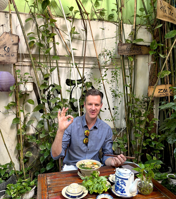 Foreign travelers enjoying vegan meals in Vietnam