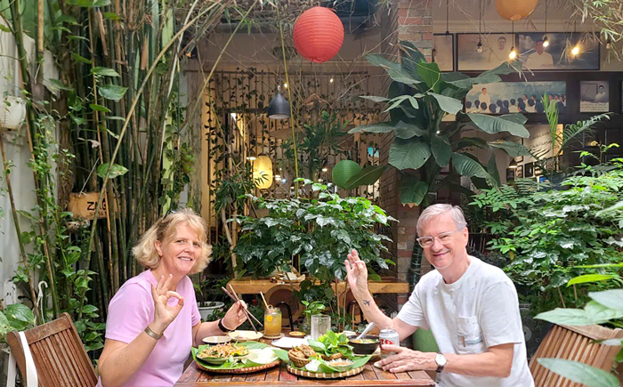Foreign visitors enjoying mindful vegan dining