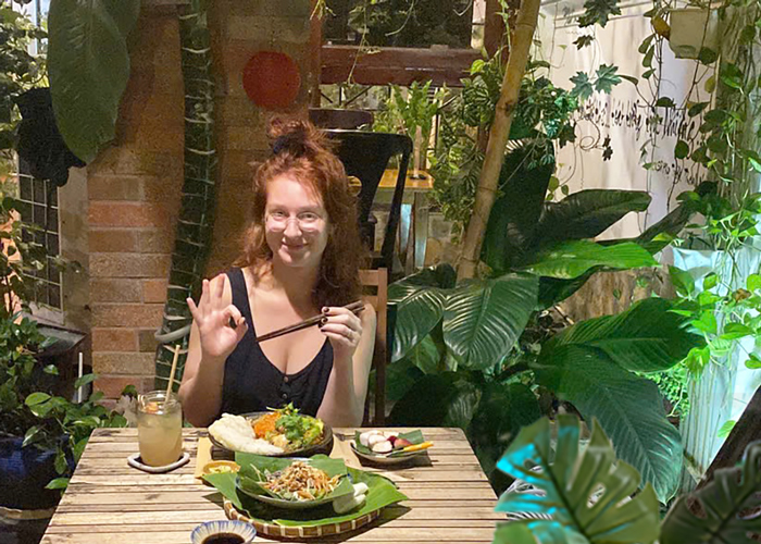Foreign travelers enjoying Vietnamese vegetarian dishes in Ho Chi Minh City.