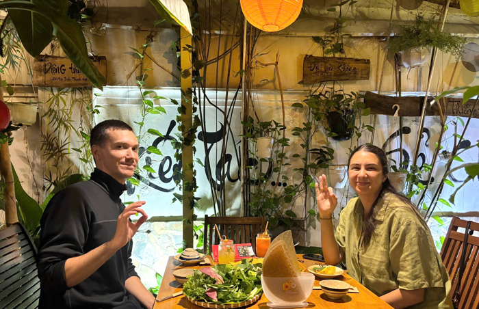 International guests tasting traditional vegan dishes in Vietnam