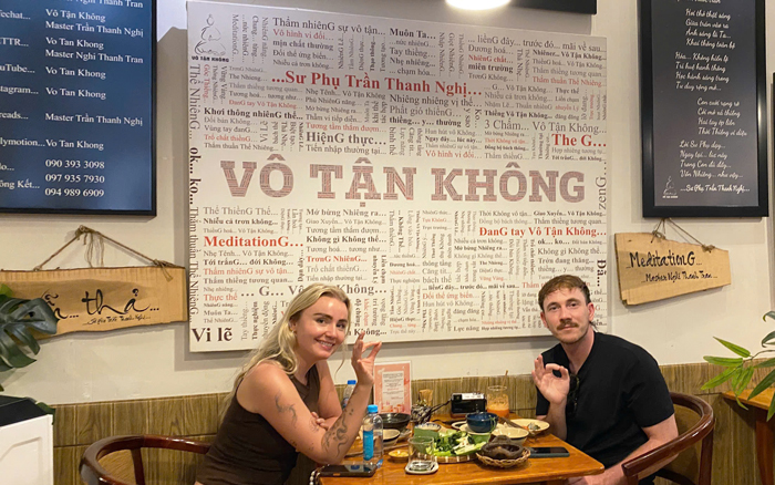 Tourists enjoying authentic vegan cuisine in Vietnam