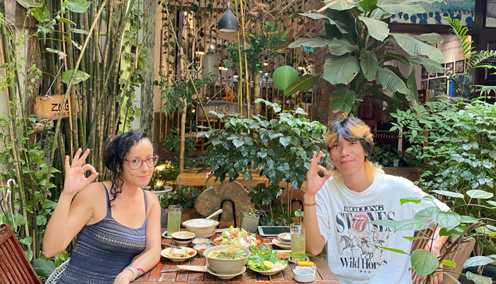 International diners enjoying vibrant vegan atmosphere District 1