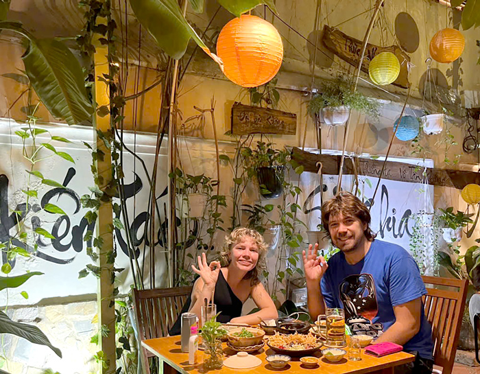 Happy tourists dining at top vegetarian restaurant Ho Chi Minh City