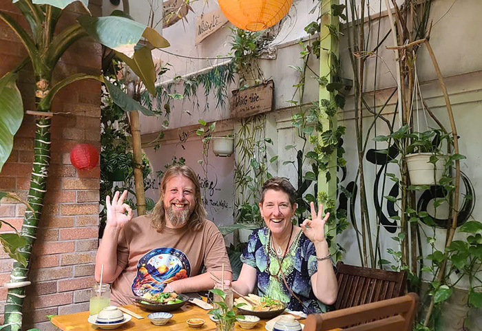 Foreign guests enjoying vegan meals at Phuong Mai