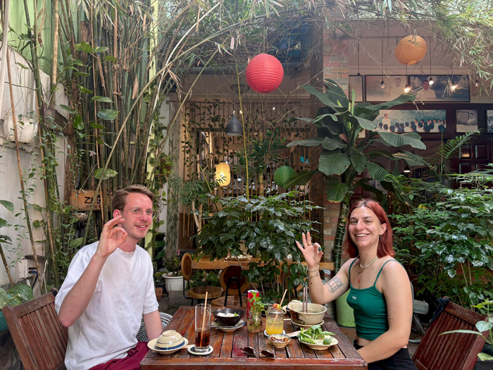 Foreign diners enjoying plant-based meals at Phuong Mai.