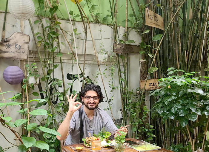 Western guests raising glasses at vegetarian restaurant Ho Chi Minh City