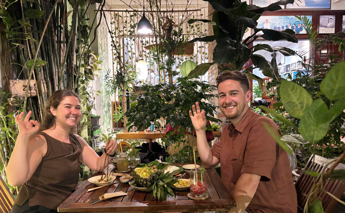 Western diners reacting happily to plant-based Vietnamese cuisine