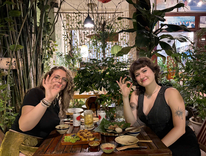 International visitors dining at a Vietnamese vegetarian restaurant.