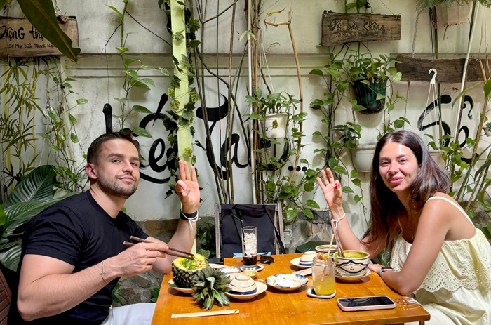 Visitors from abroad dining at a vegetarian restaurant in Vietnam.