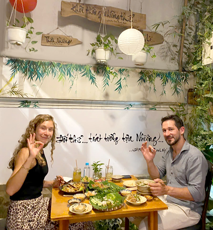 Tourists enjoying healthy vegetarian meals while visiting Saigon.