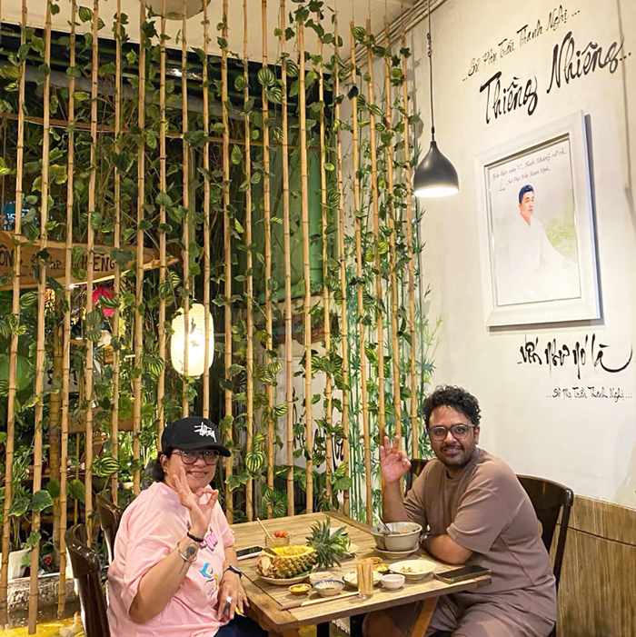 Foreign visitors enjoying vegetarian food at a well-known restaurant in District 1.