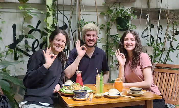 International travelers dining at a vegan restaurant in Vietnam