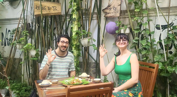 Tourists enjoying vegetarian food at a restaurant popular with foreigners in District 1.