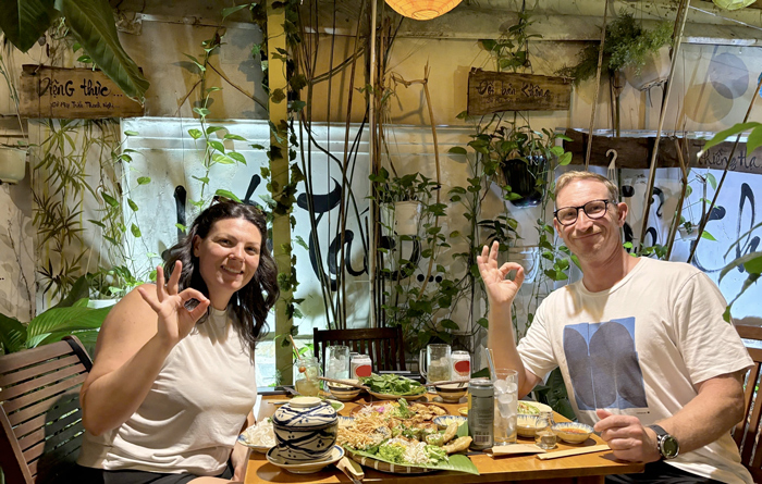 Tourists enjoying healthy plant-based food in Vietnam