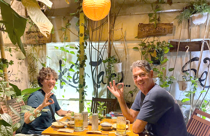 Western couple discovering vegan restaurant in Saigon