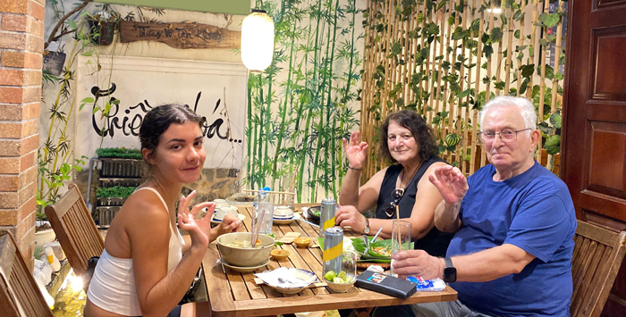 Foreign visitors tasting Vietnamese vegetarian food in Ho Chi Minh City