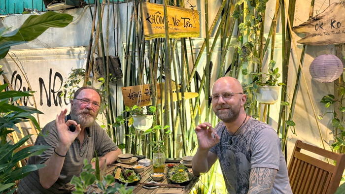 Western couple enjoying vegan lunch in Saigon