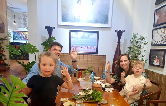Tourists enjoying a peaceful vegan meal at Phuong Mai Restaurant