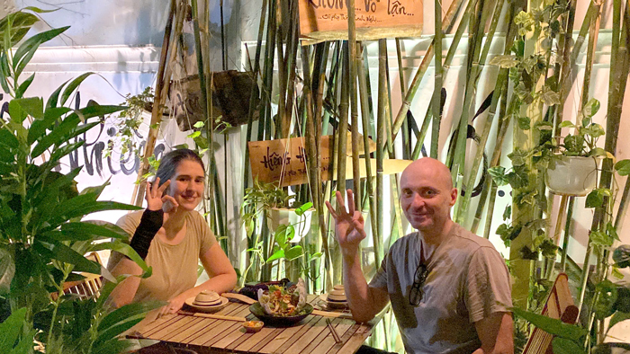 Foreign travelers enjoying peaceful vegan dining