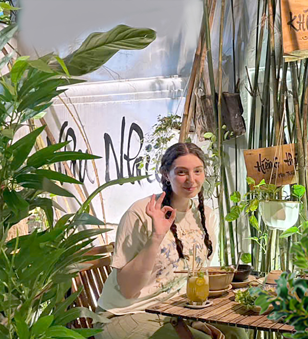 Western tourists enjoying lively vegan restaurant in District 1 Ho Chi Minh City