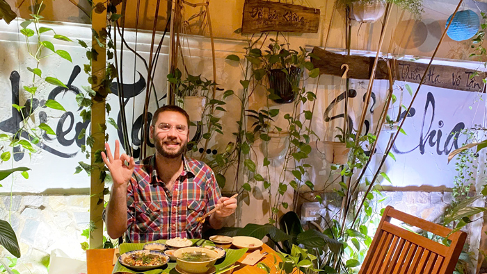 Foreign tourists visiting vegetarian restaurant near Vo Thi Sau