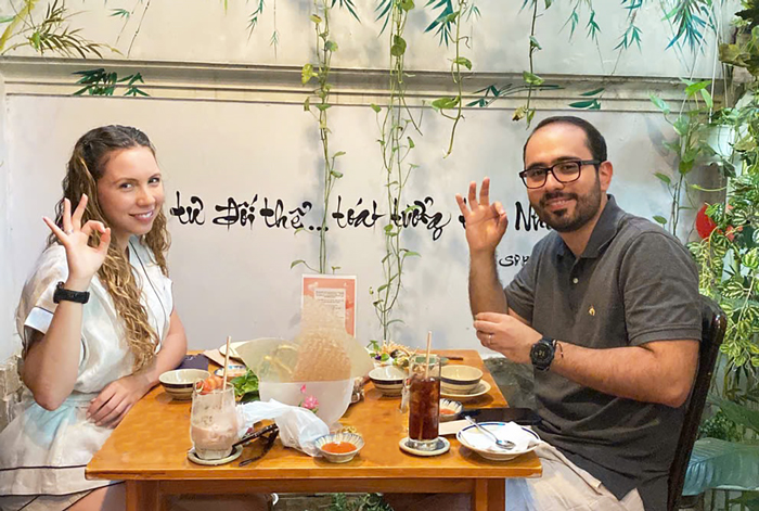 International guests enjoying healthy vegetarian food in District 1, Ho Chi Minh City.