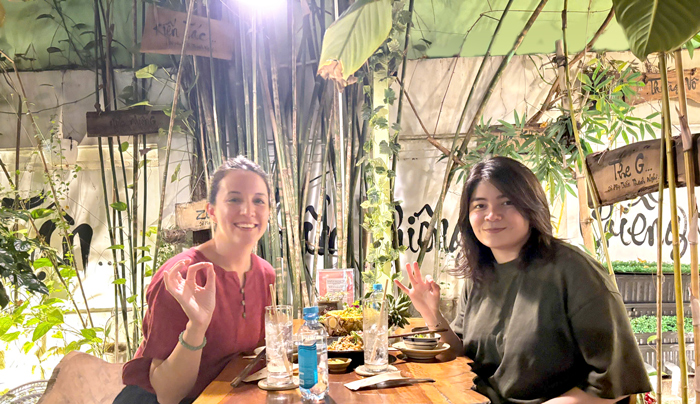Foreign customers enjoying cozy vegan restaurant in Saigon