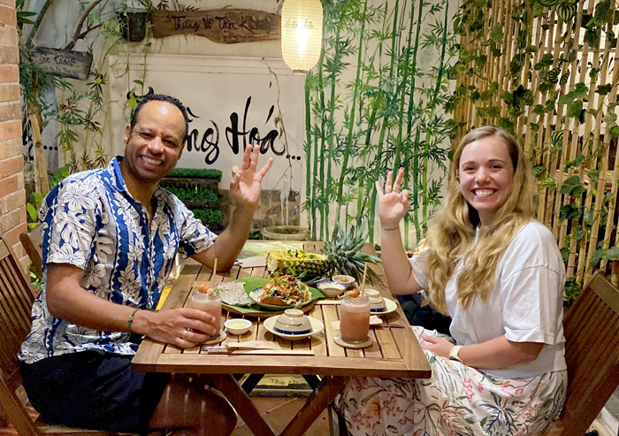 Foreign tourists enjoying vegetarian dining at a local restaurant in District 1.