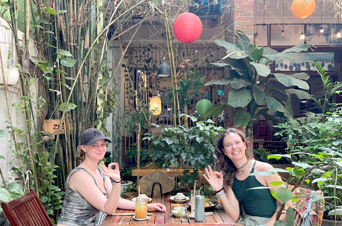 Tourists discovering healthy vegetarian restaurant in District 1