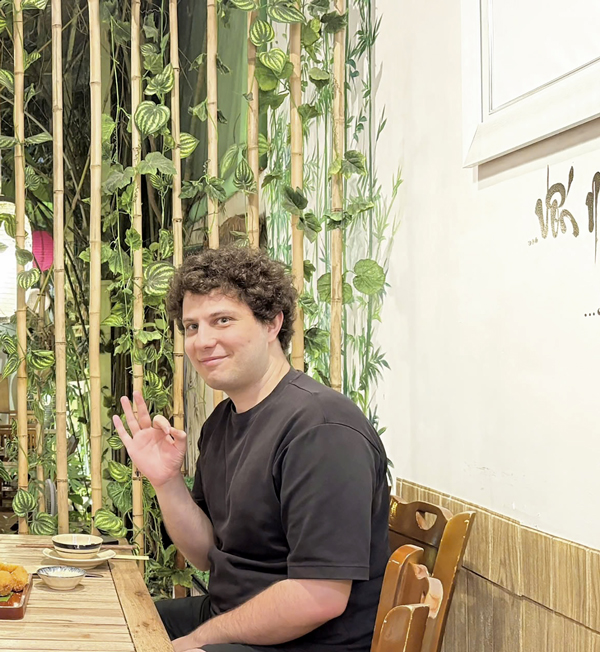 Foreign family dining at healthy vegetarian restaurant District 1