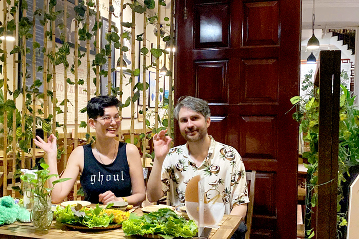 International travelers enjoying vegan dining in Vietnam